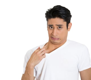 Closeup portrait of young business man opening shirt to vent, it's hot, unpleasant, awkward situation, embarrassment. Isolated white background. Negative human emotions, facial expression, feelings-1.jpeg