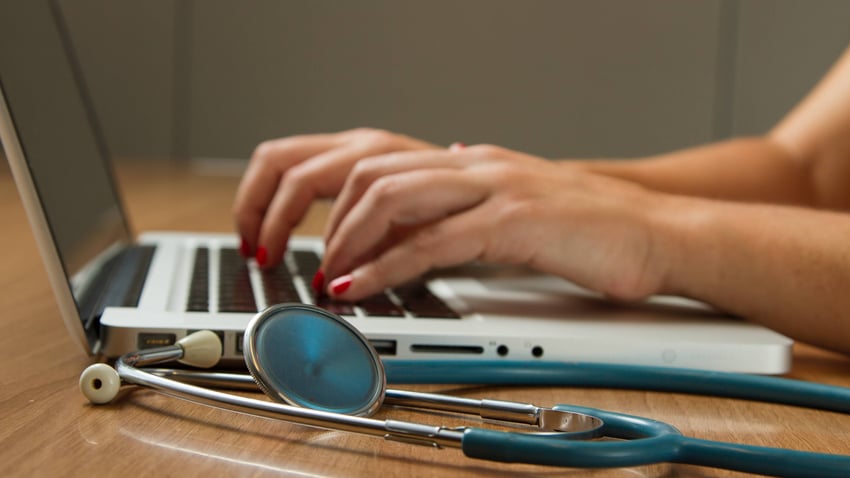 Laptop and stethoscope image by National Cancer Institute - via Unsplash
