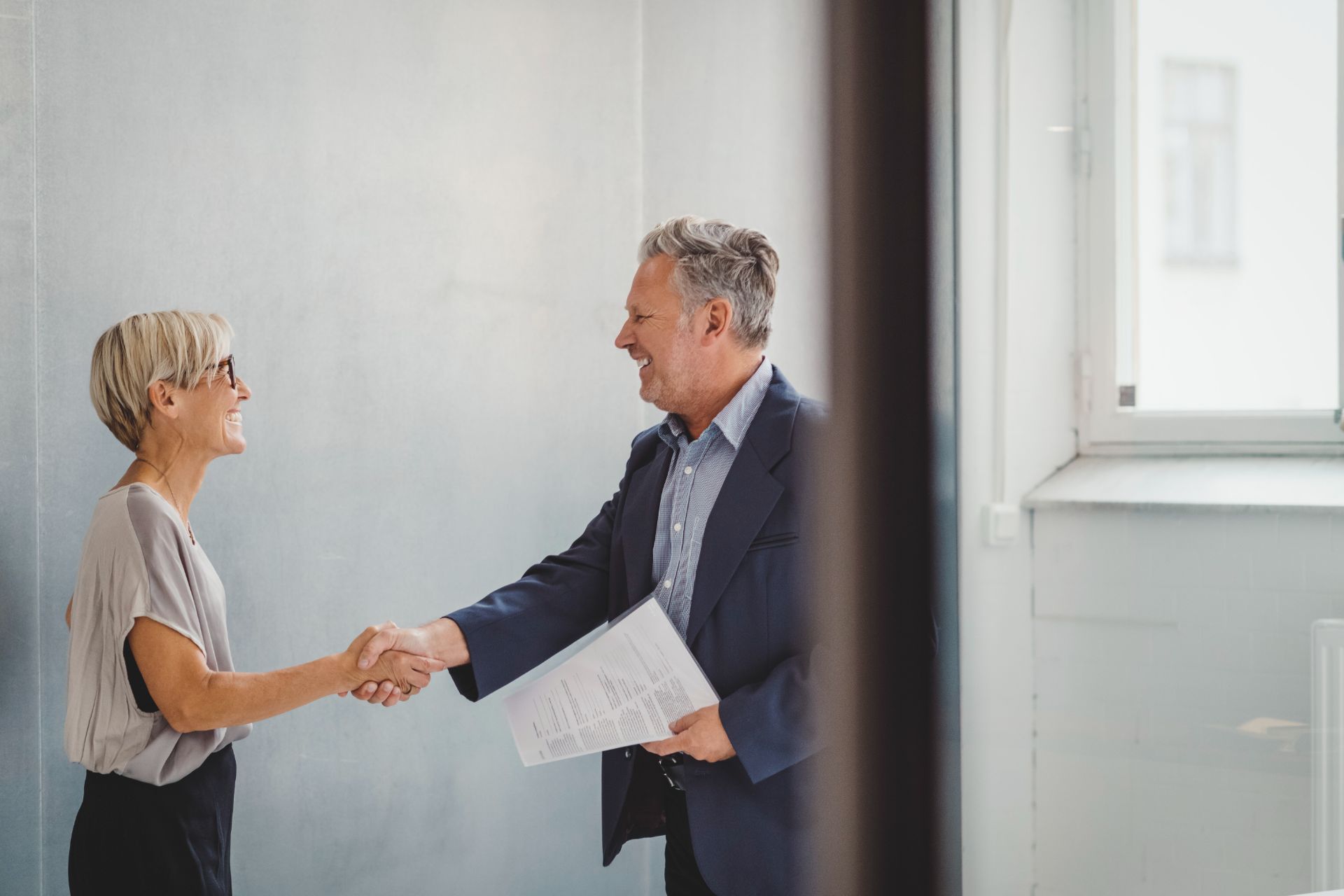 Employees shaking hands